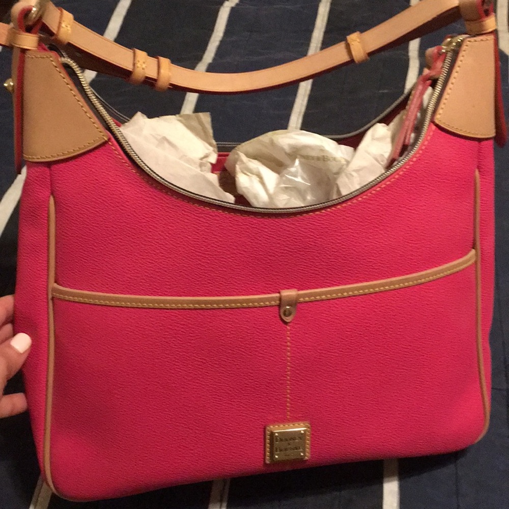 Dooney & Bourke - woman’s pink purse.